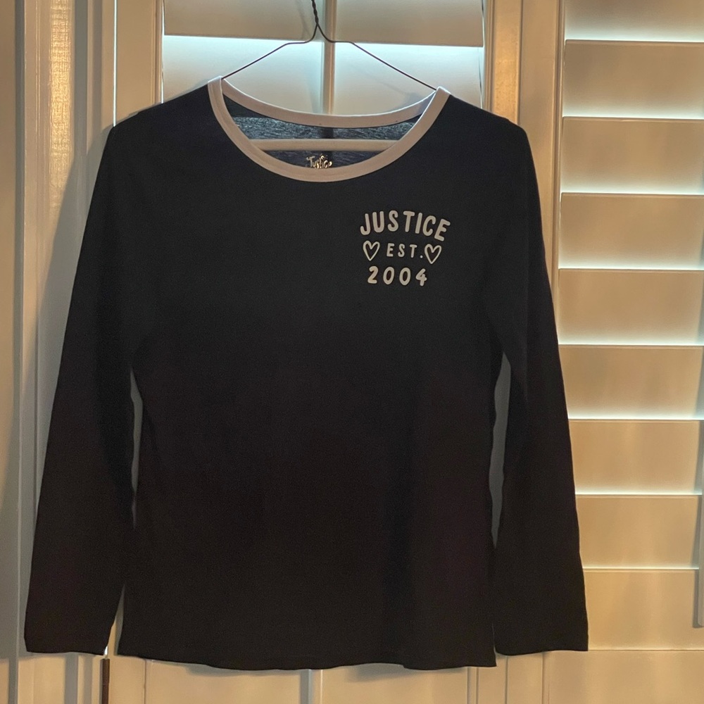 This is a black and white justice shirt. It’s in exceptional condition!!!